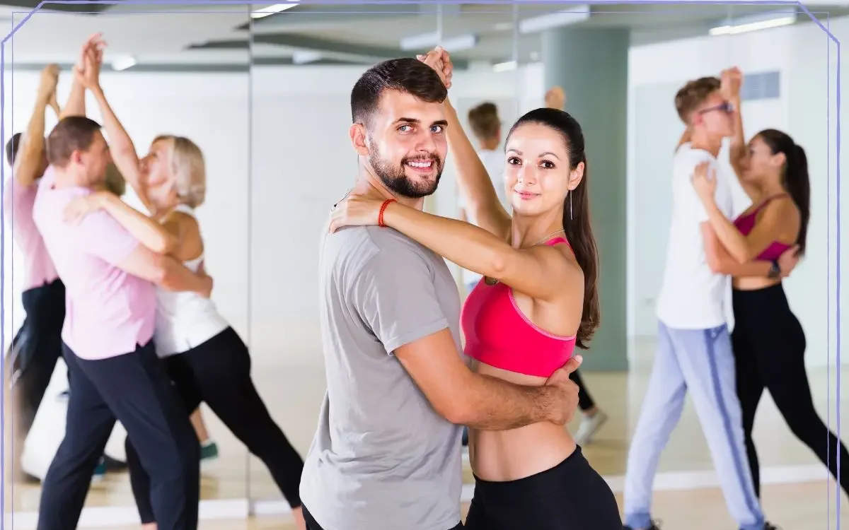 Couples enjoying ballroom dance lessons as part of a dancing for health and wellness program