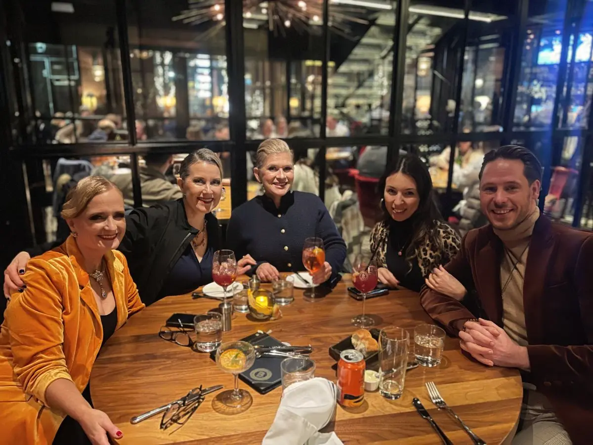 MI Fiesta Dance Studio community celebrating after a pro-am dance competition at a local restaurant.