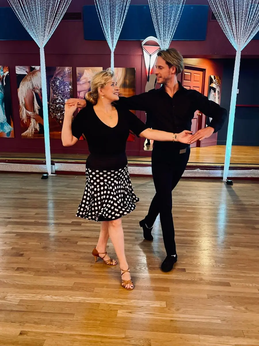 Ballroom dance pose at MI Fiesta Dance Studio near Boston with student and teacher.