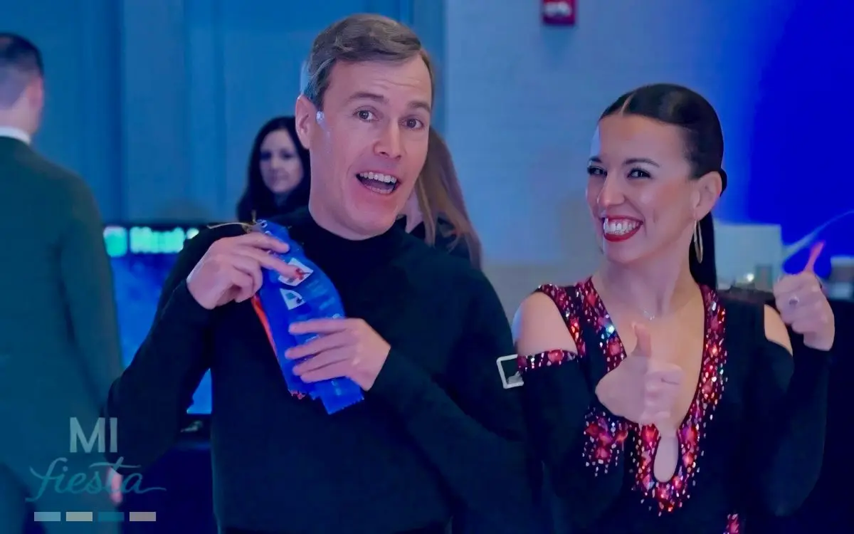 Ballroom dancers Mariam and Ned smiling after winning first place at the Patriot Dance Festival 2025 in Burlington