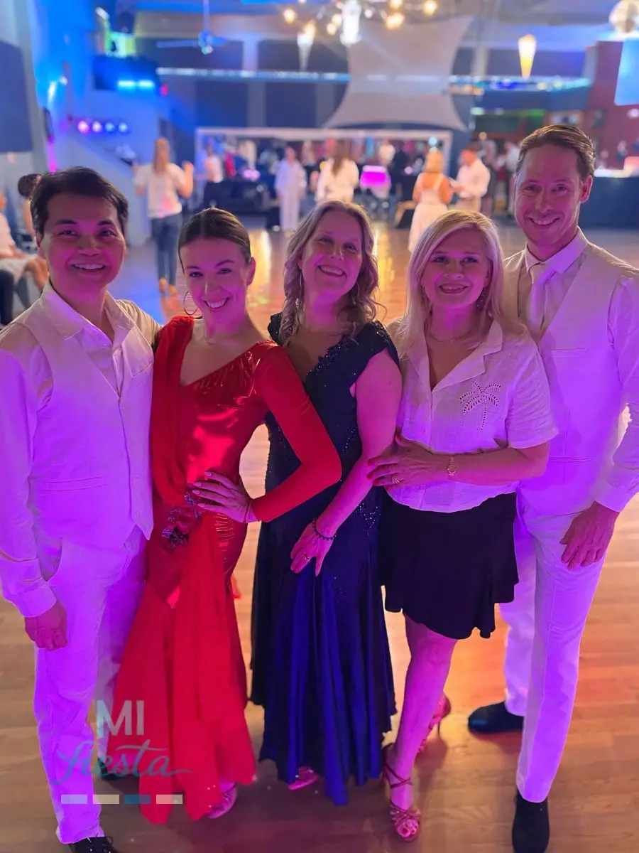 Mi Fiesta Dance performers and students smiling together after their ballroom dance lessons and shows