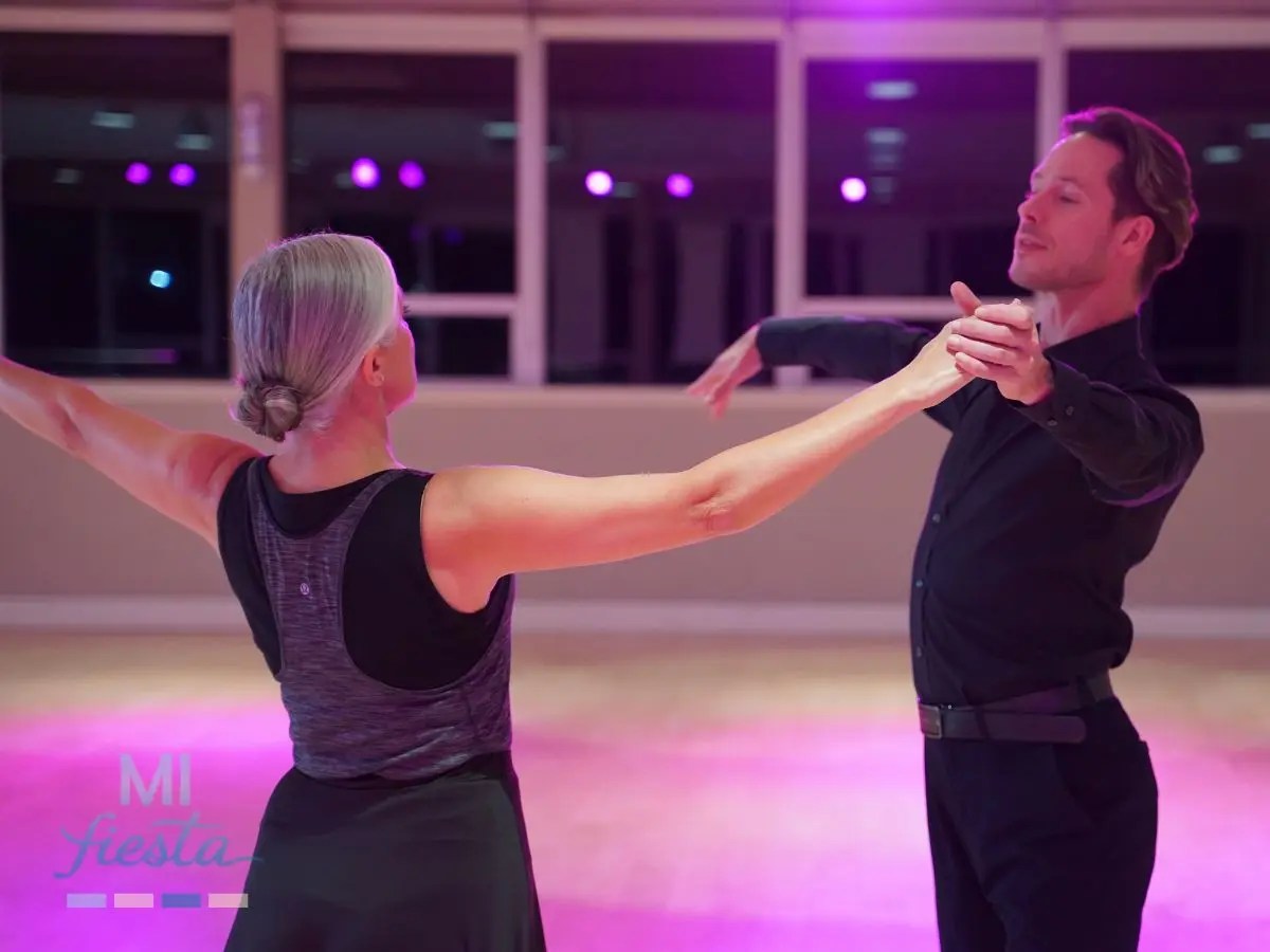 Rubina Motta practicing ballroom frame during a pro am ballroom dance training session as part of her beginner ballroom dancing journey.